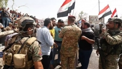 لماذا يحجم العرب السُنّة عن المشاركة في الاحتجاجات العراقية؟ (تحليل)